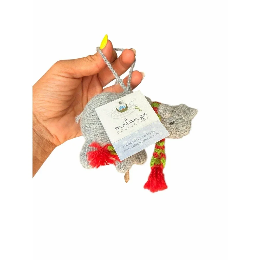 New Mélange Collection hand-knitted rhino ornament, featuring a cozy scarf